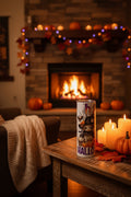 Happy HalloThanksMas 20 oz tumbler showing HALLO with child in witch hat, skull and pumpkins, with HAPPY around the top