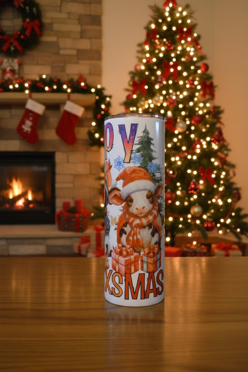 Happy HalloThanksMas 20 oz tumbler showing XMAS with cartoon cow wearing a Santa hat, with HAPPY around the top