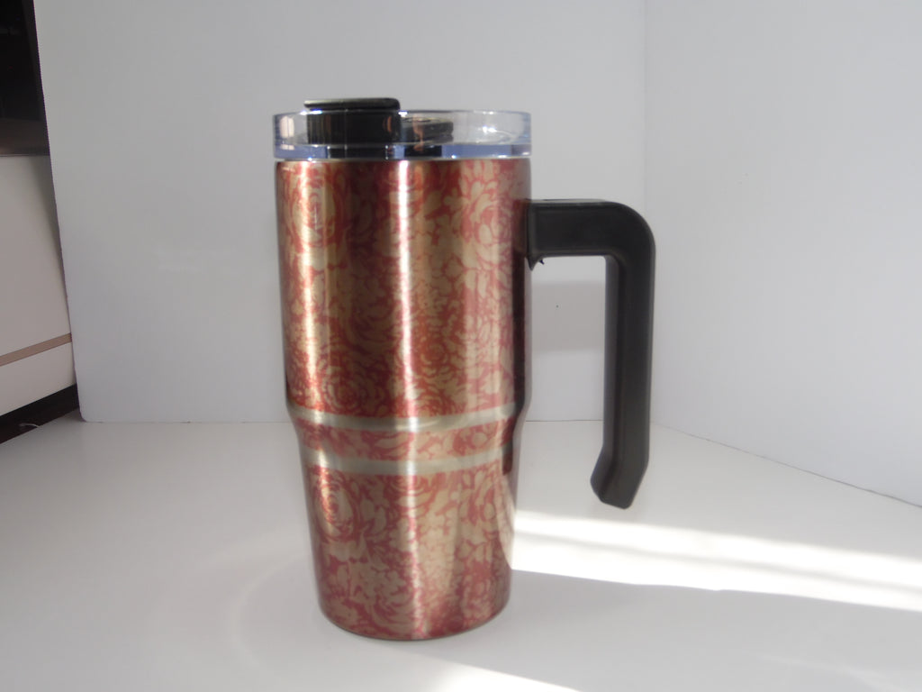Original photo of reddish-pink patterned grippy cup with silver-colored bands, black handle and clear lid