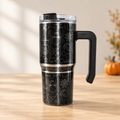 Black Halloween grippy cup in a seasonal tabletop setting