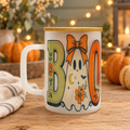 Floral ghost mug in a cozy Halloween setting